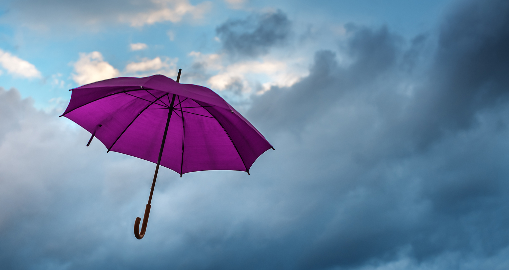 Purple umbrella in sky