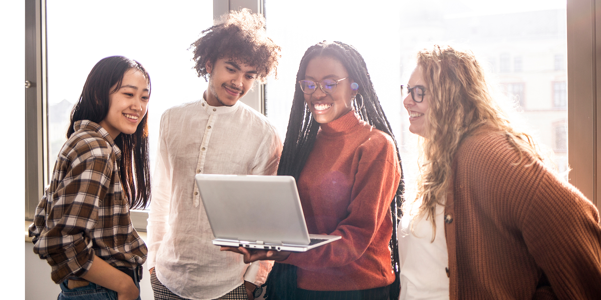 Four graduate students exploring job opportunities with AIB.