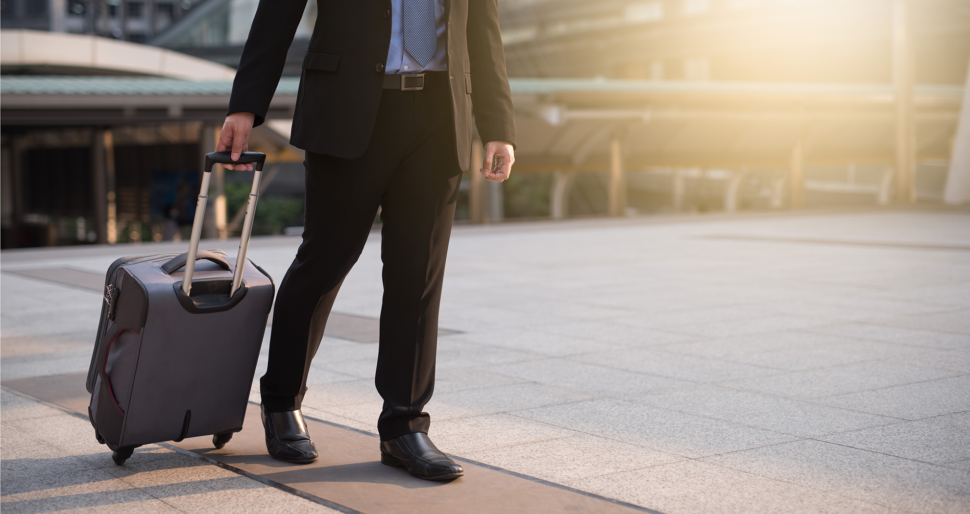 businessman walking with suitcase