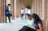 Students in an outdoor archway reading books and exploring.